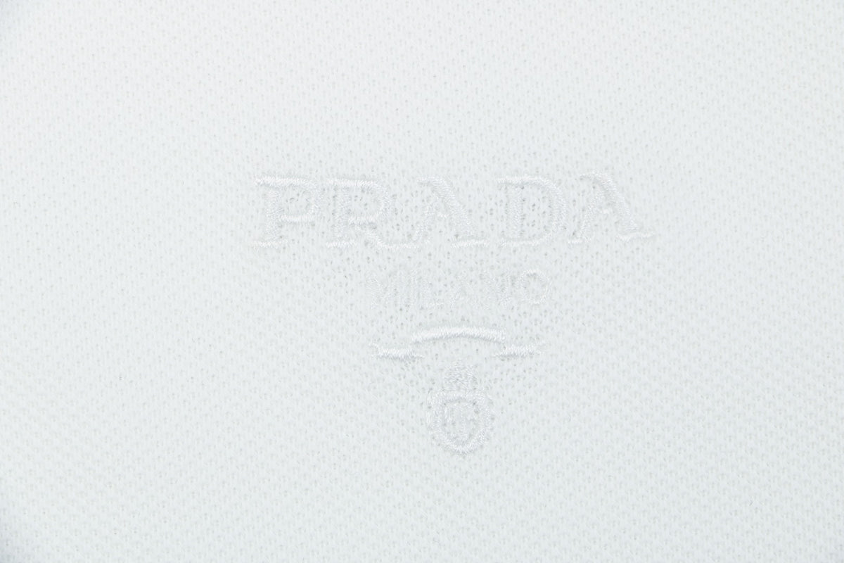 Prada Jacquard Medal Badge Contrast Collar Polo Shirt – White